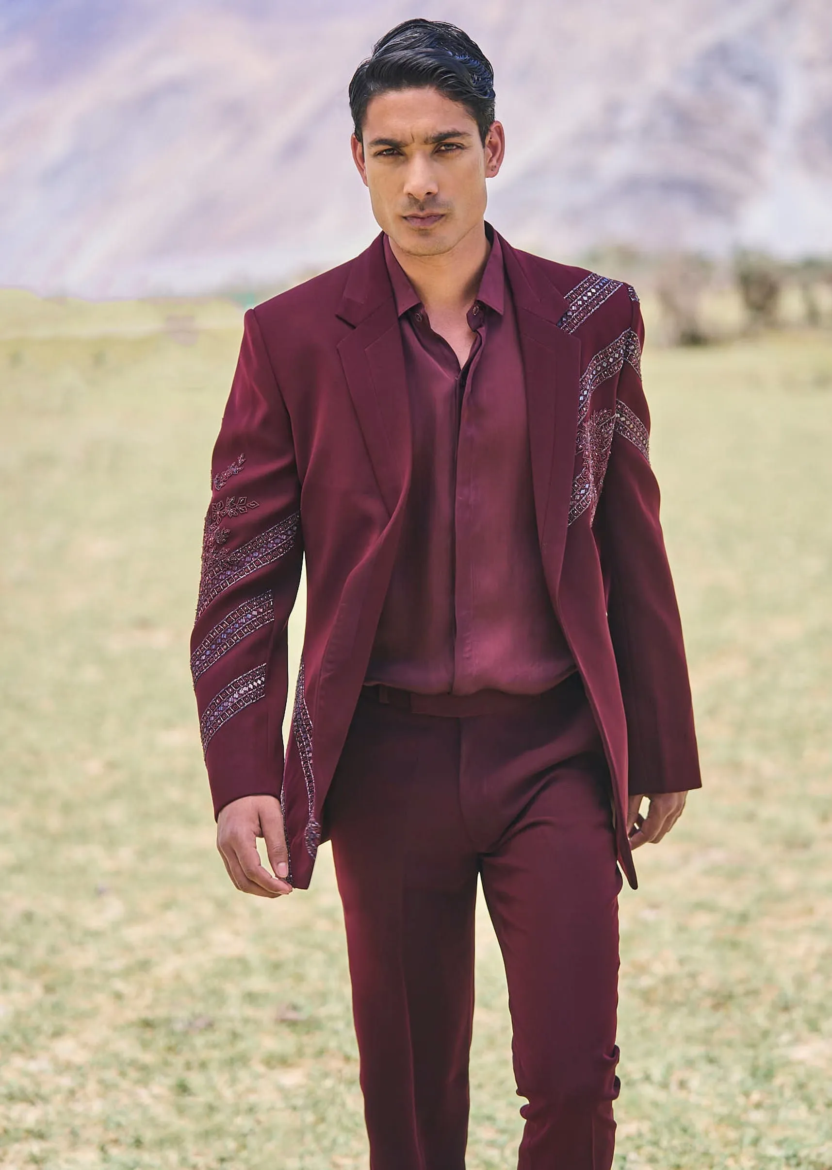 Deep Wine Self Embroidered Tuxedo With Geometric Motifs